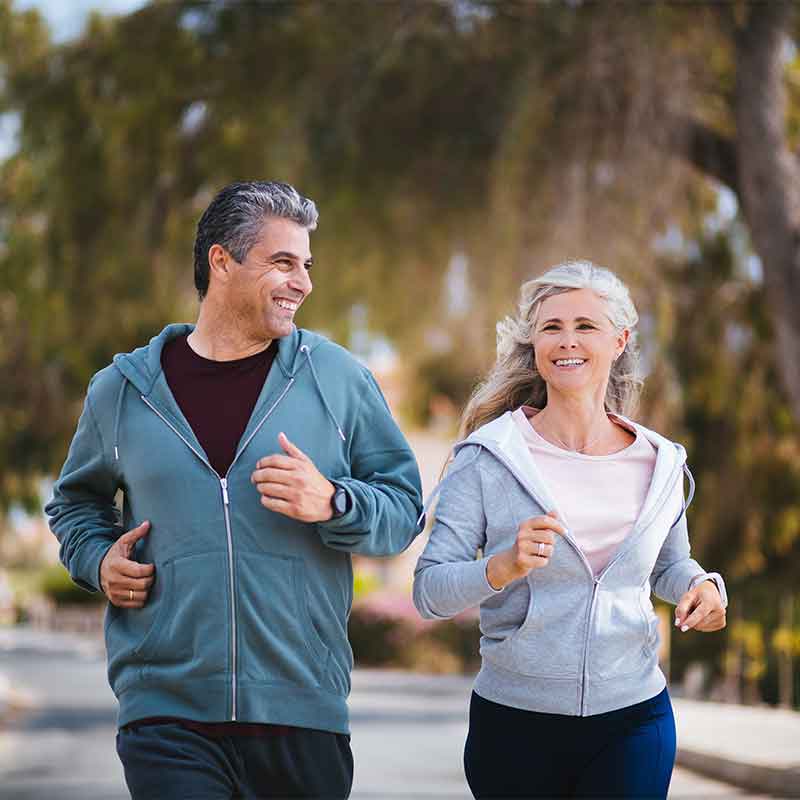 couple jogging down the road